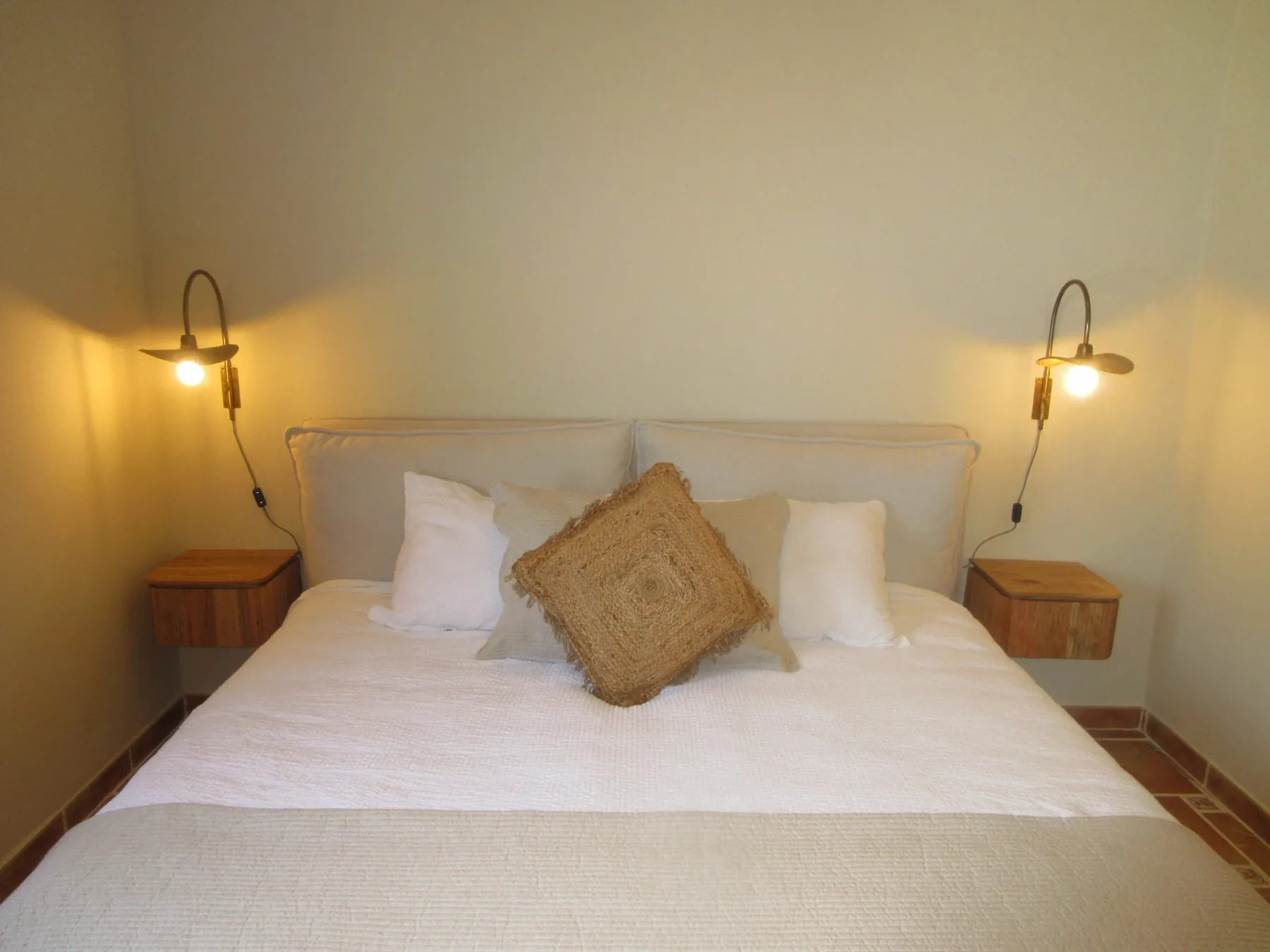 Guest bedroom with double bed and ambient lamps