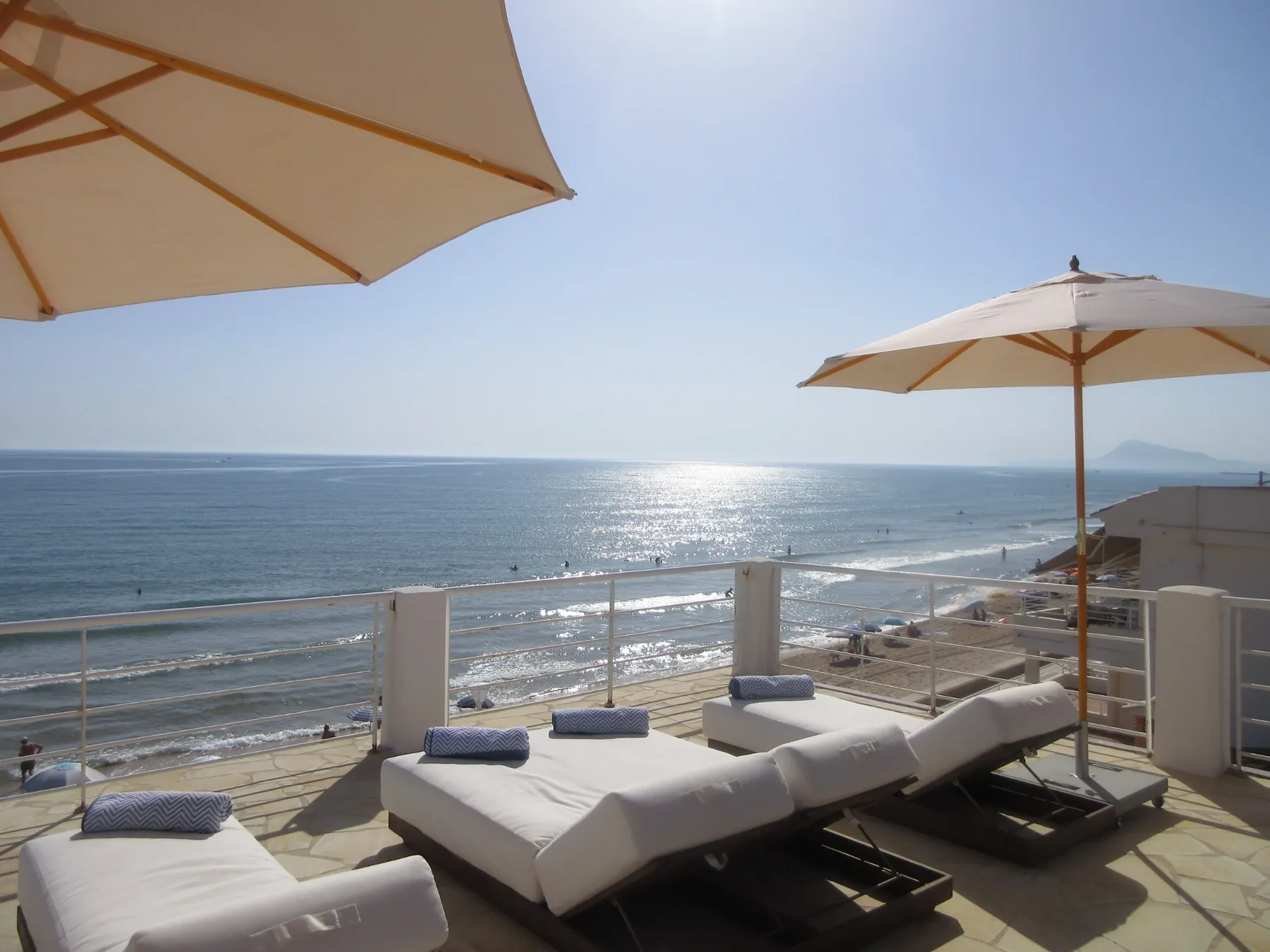 Rooftop sun loungers beside the Mediterranean Sea